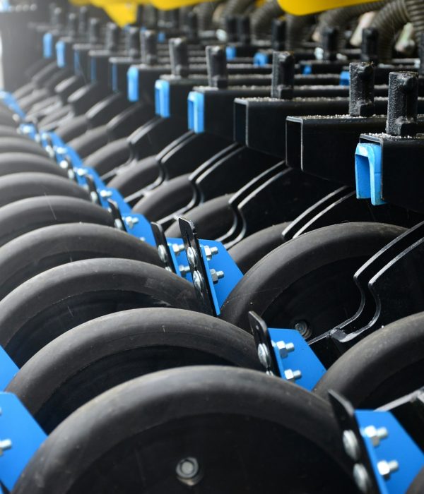 Row of wheels of the new industrial agricultural seeder close up